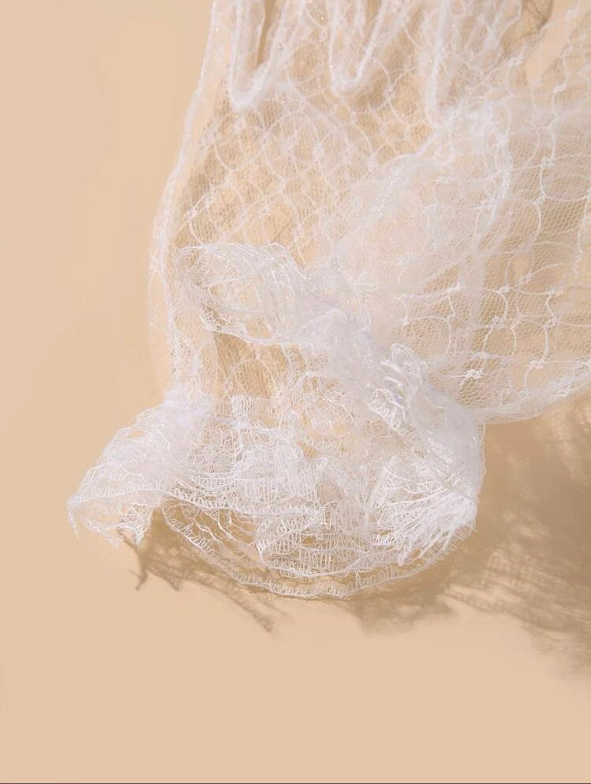 Sheer white bridal accessory gloves