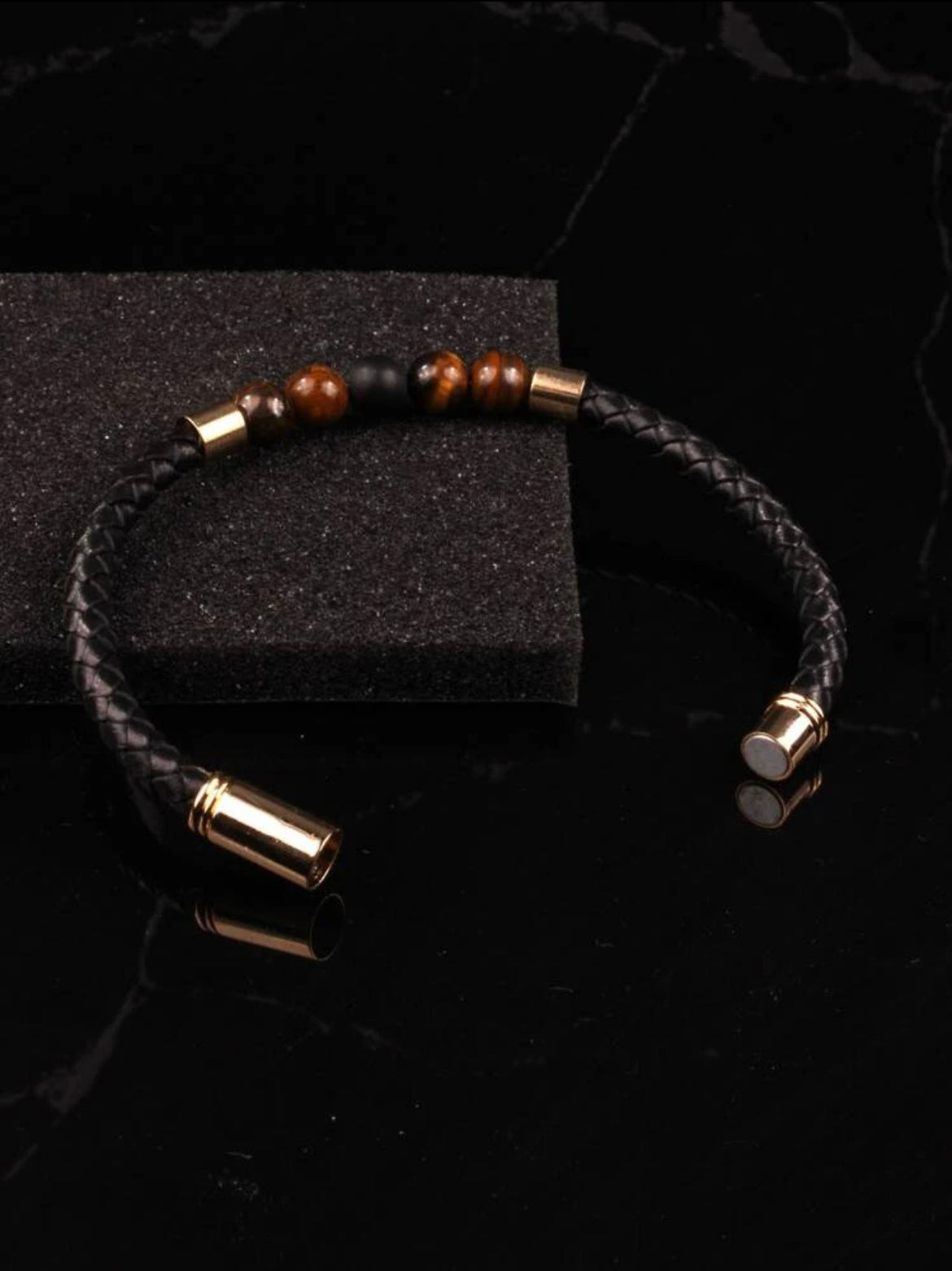 MAgnetic clasp. Woven black leather design. Perfect every day mens bracelet.