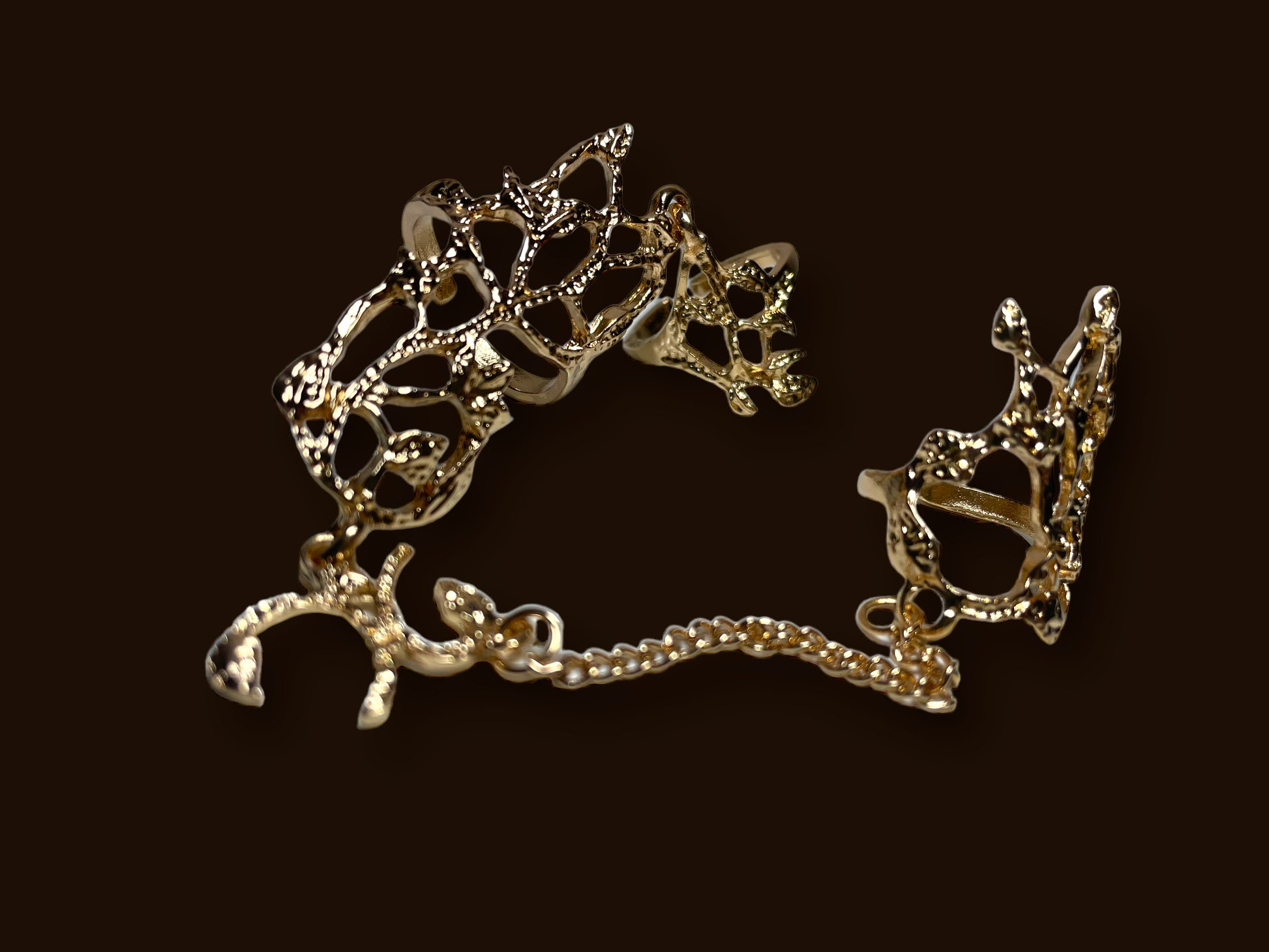 Gold floral design chain rings