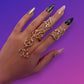 Gold floral mitten chain rings