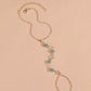 Star anklet with luminous blue beads.