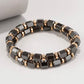 Stylish mens bracelet set. Gunmetal beaded bracelets with gold.