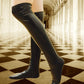 Black vegan leather knee length socks.