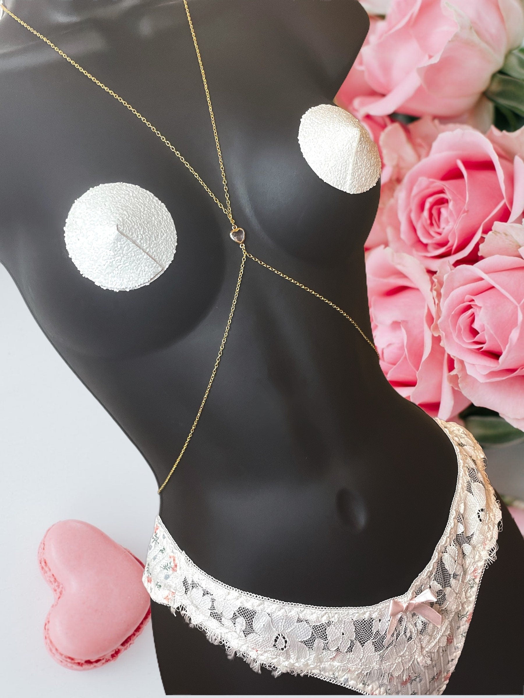 White glitter pasties on mannequin with our signature heart matching body chain
