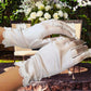 Wrist length white wedding gloves